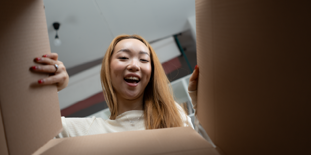 img_1080x540_woman-looking-in-open-box